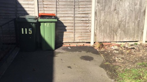 Waste materials being loaded into a skip